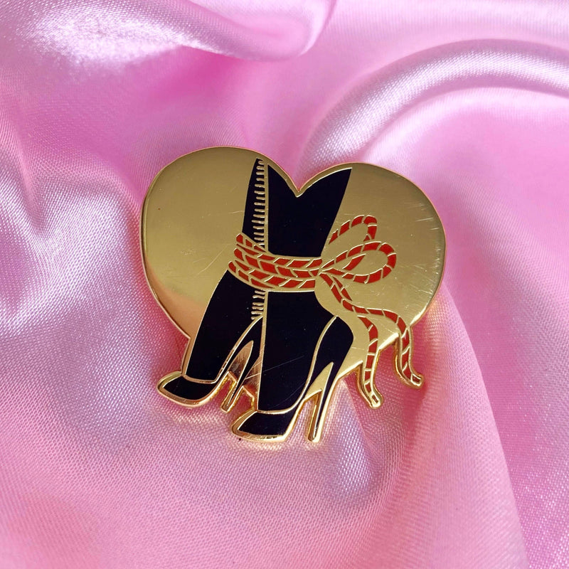 Tied feet enamel pin