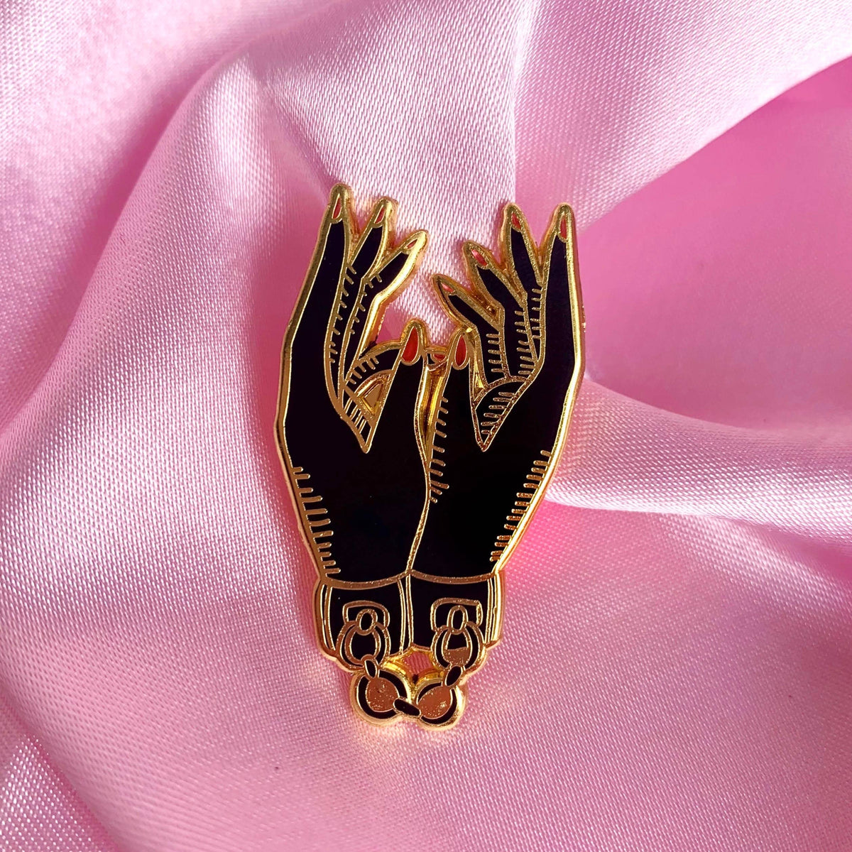 Tied hands enamel pin